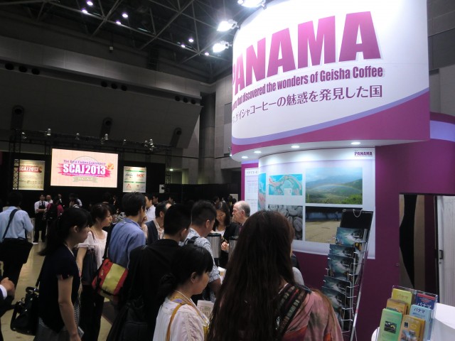 CIMG0137 Visitors at the Panamanian Pavilion tasting the Geisha coffee.